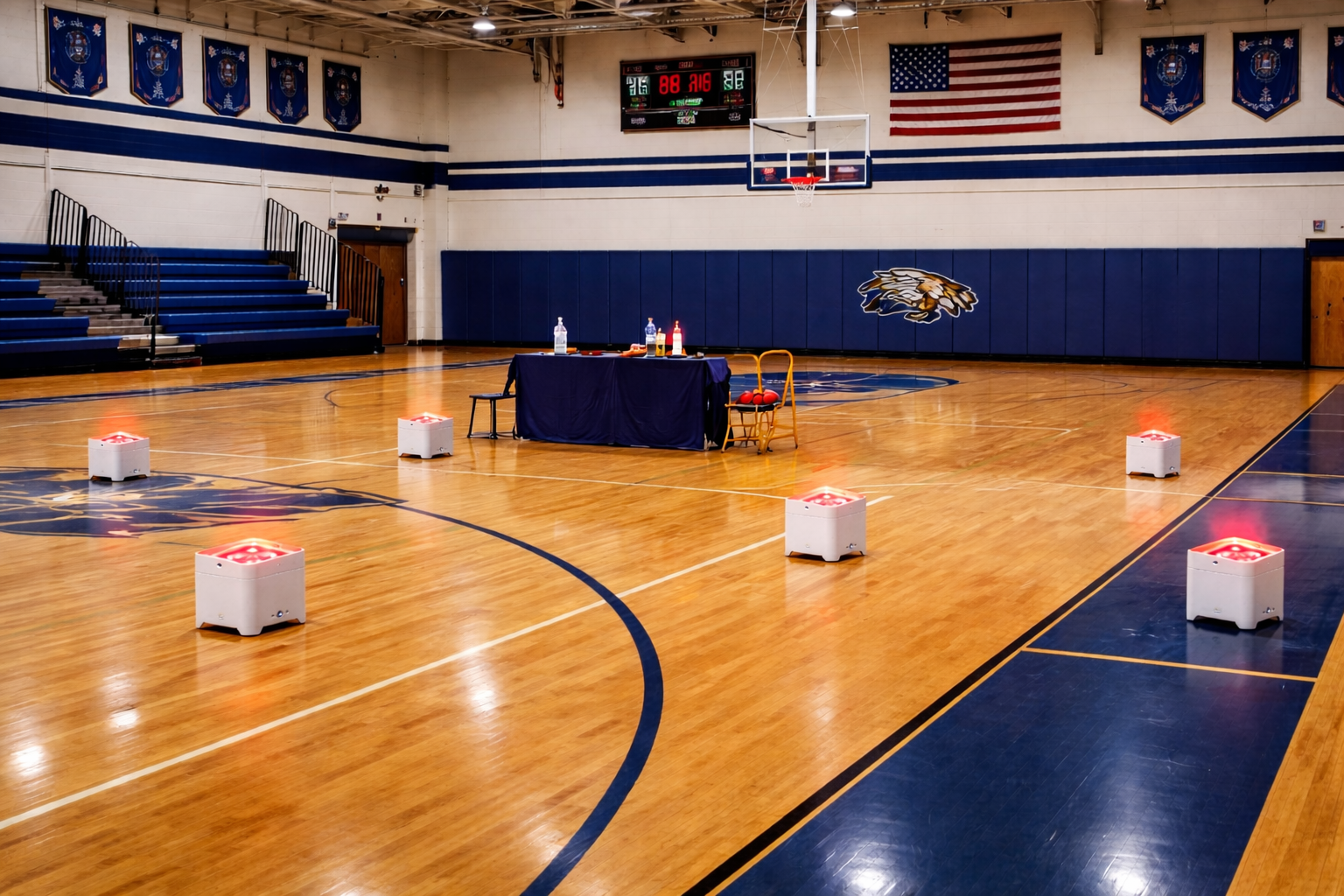 Uplights washing a school gym floor